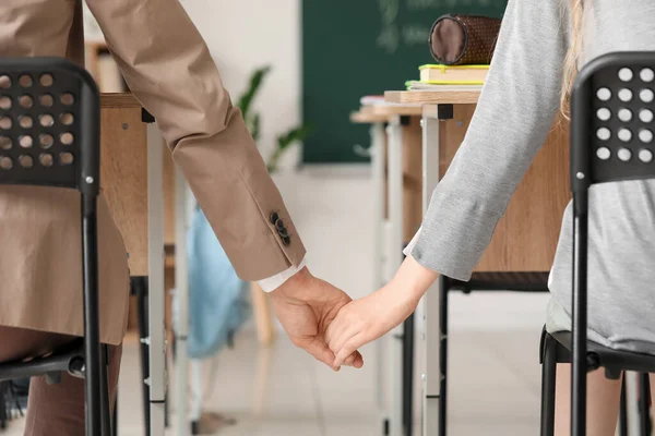 Teenage Couple Holding Hands Classroom Back View — Stock Photo, Image