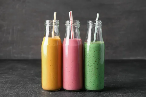 Bottles Colorful Smoothie Dark Table — Stock Photo, Image