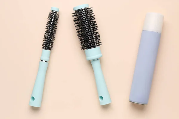 Brushes Hair Spray Beige Background — Stock Photo, Image