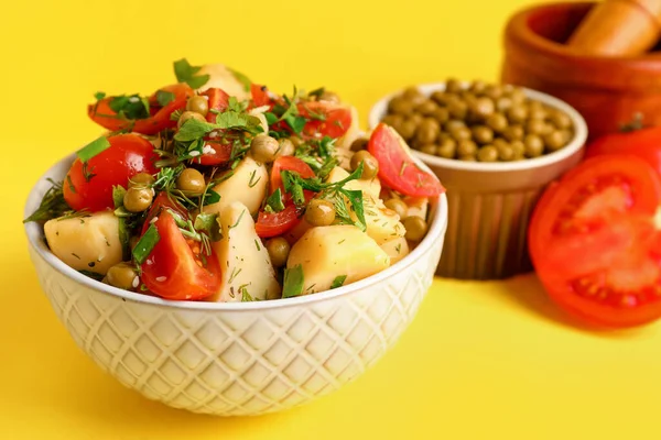 Bowl Tasty Potato Salad Vegetables Yellow Background — Stock Photo, Image