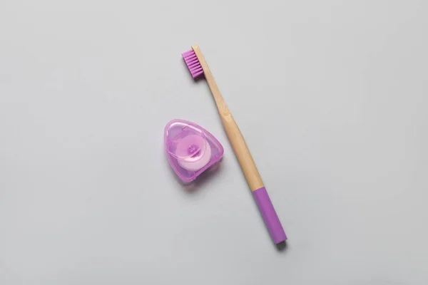 Dental Floss Purple Bamboo Toothbrush Grey Background — Stock Photo, Image