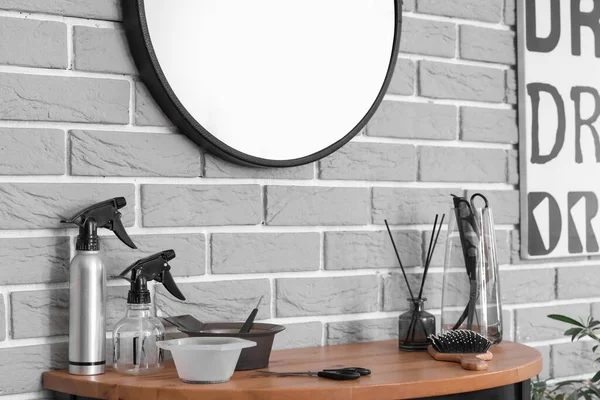 Different Hairdressing Tools Table Grey Brick Wall — Stock Photo, Image