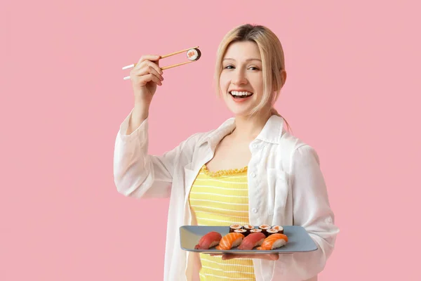Young Woman Sushi Pink Background — Stock Photo, Image