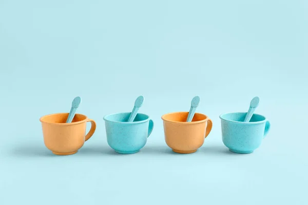 Different Colorful Cups Spoons Blue Background Children Day Celebration — Stock Photo, Image