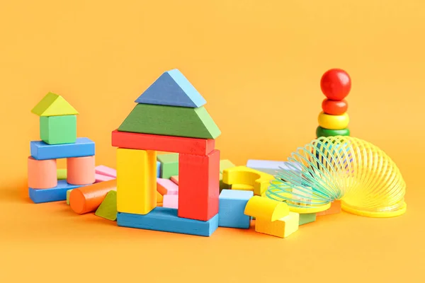 Diferentes Brinquedos Coloridos Fundo Laranja Celebração Dia Das Crianças — Fotografia de Stock