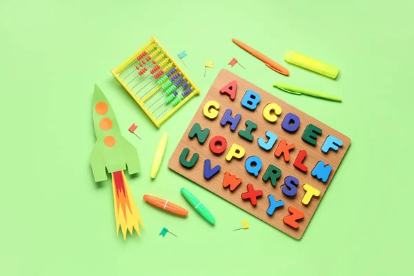 Paper Rocket Abacus Wooden Letters Stationery Green Background — Stock Photo, Image
