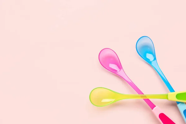Different Colorful Spoons Baby Pink Background — Stock Photo, Image