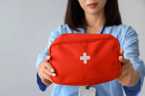 Female Asian Medical Intern First Aid Kit Grey Background Closeup — Stock Photo, Image