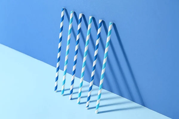 stock image Different paper drinking straws on blue background