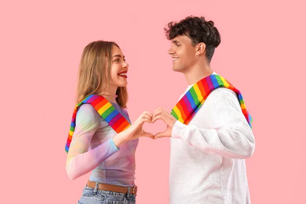 Young Couple Lgbt Flags Making Heart Pink Background — Stock Photo, Image