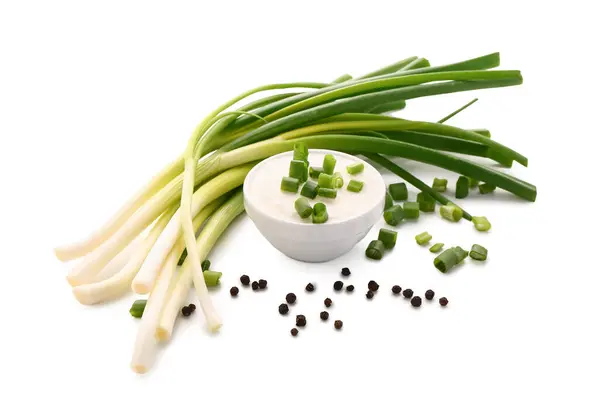 Bowl Tasty Sour Cream Sliced Green Onion Peppercorn White Background — Stock Photo, Image