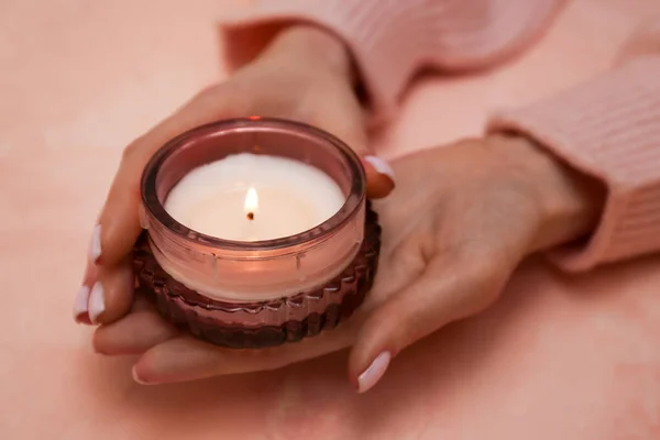 Female Hands Beautiful Burning Candle Pink Background Closeup — Stock Photo, Image