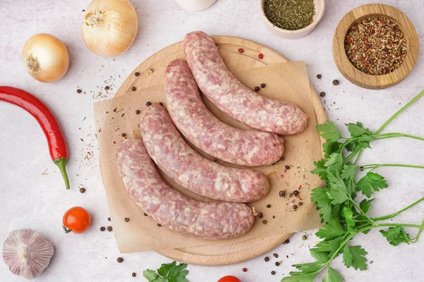 Wooden Board Raw Homemade Sausages Light Background — Stock Photo, Image