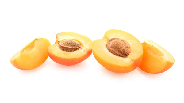 stock image Ripe cut apricots isolated on white background