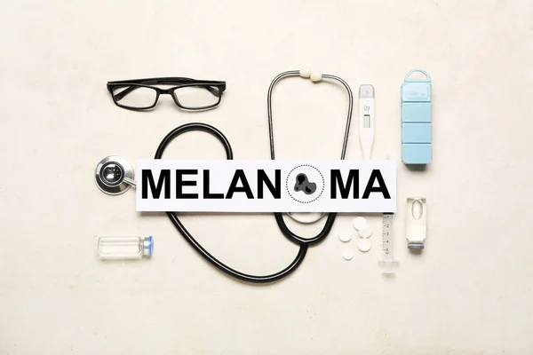 Banner with word MELANOMA and doctor\'s accessories