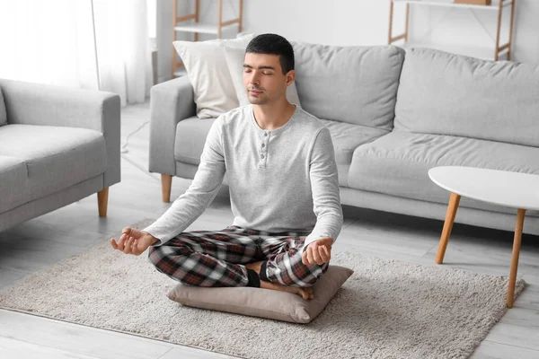 Young Man Pajamas Meditating Pillow Home — Foto de Stock