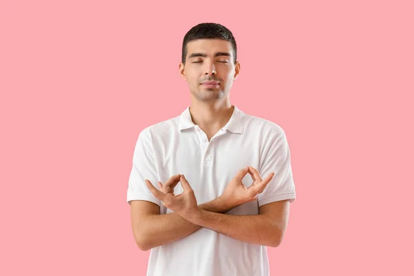 Young Guy Meditating Pink Background — Fotografia de Stock