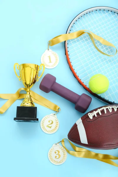 Gold Cup Prize Medals Sports Equipment Blue Background — Stock Photo, Image