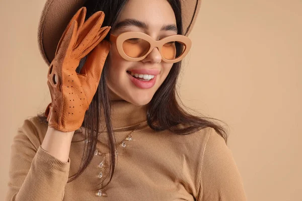 Stylish Young Woman Sunglasses Leather Glove Beige Background Closeup — Stock Photo, Image