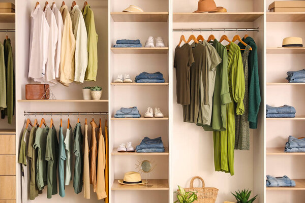 Stylish clothes with shoes in boutique