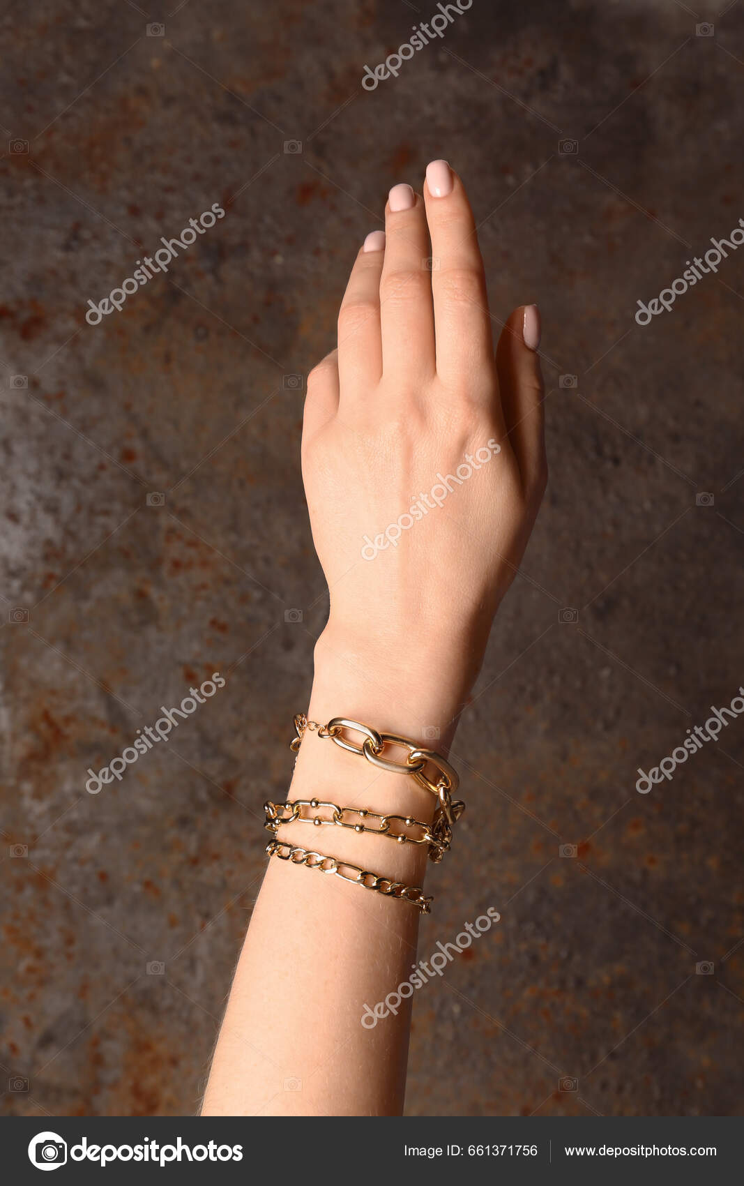 Female Hand Different Beautiful Golden Bracelets Grunge Brown Background  Stock Photo by ©serezniy 661371756