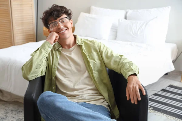 Young Man Eyeglasses Sitting Bedroom — Stock Photo, Image