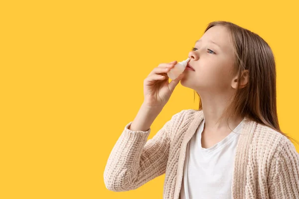 Ill Little Girl Nasal Drops Yellow Background Closeup — Stock Photo, Image
