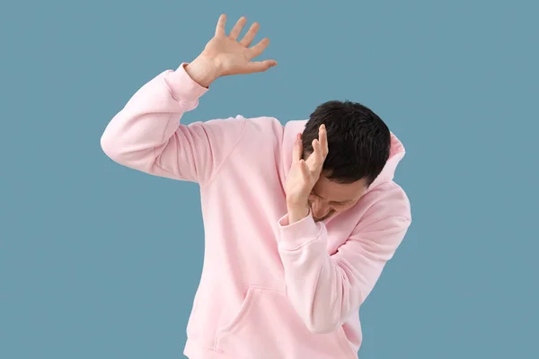 Young Man Having Panic Attack Blue Background — Stock Photo, Image