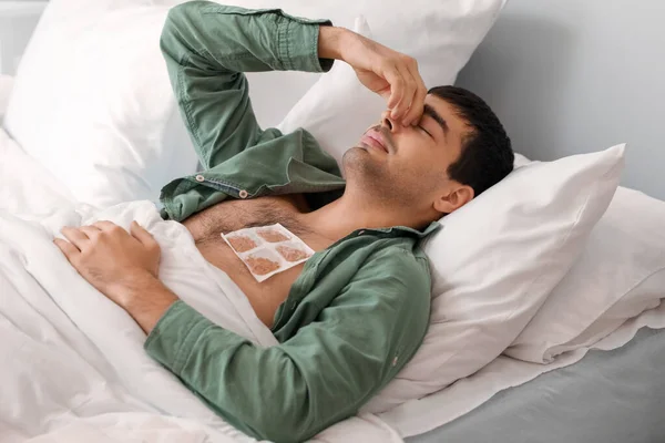 Ill Young Man Mustard Plaster His Chest Lying Bedroom — Stock Photo, Image