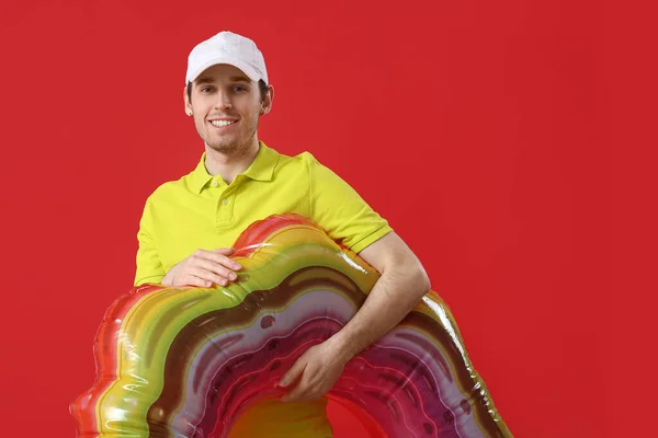 Young Man Inflatable Ring Red Background — Stock Photo, Image