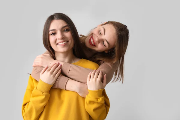 Female Friends Hugging Light Background — Stock Photo, Image