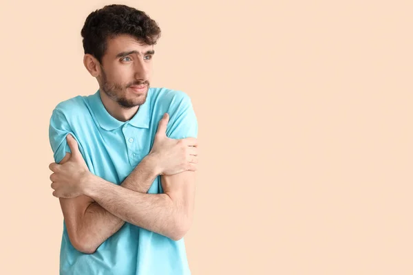 Young Man Having Panic Attack Beige Background — Stock Photo, Image