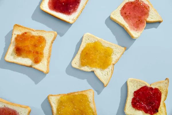 Delicious Toasts Different Jams Light Background Closeup — Stock Photo, Image