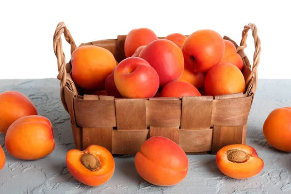 Wicker Basket Ripe Apricots Table White Background — Stock Photo, Image