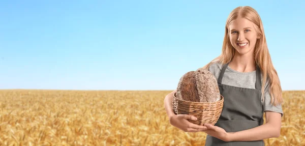 Young Woman Holding Basket Fresh Bread Wheat Field Banner Design — Stock Photo, Image