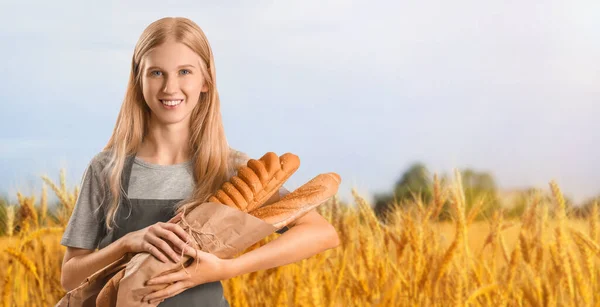 Young Woman Holding Fresh Bread Wheat Field Banner Design — Stock Photo, Image