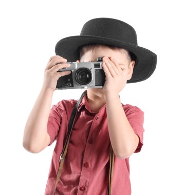 Cute little photographer with camera on white background
