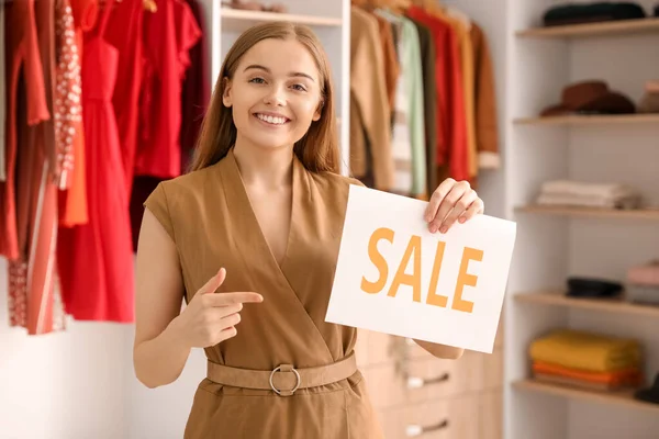 Female Seller Pointing Sale Sign Boutique — Stock Photo, Image