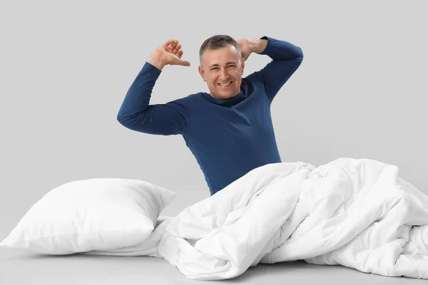 Mature Man Soft Blanket Waking Grey Background — Stock Photo, Image