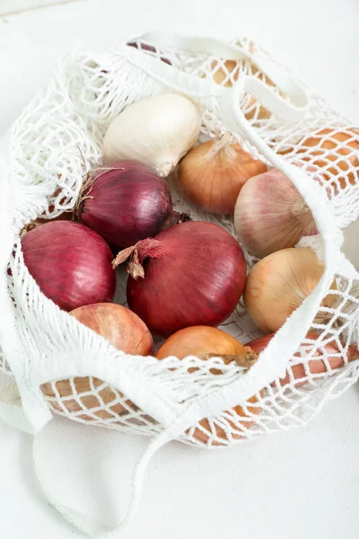 String Bag Different Kinds Onion Light Background Closeup — Stock Photo, Image