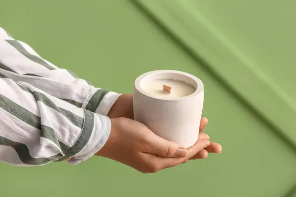 Woman Holding Candle Green Background — Stock Photo, Image