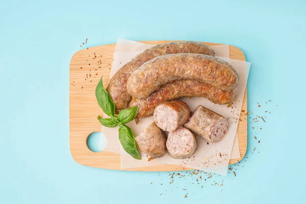 Wooden Board Tasty Homemade Sausages Blue Background — Stock Photo, Image