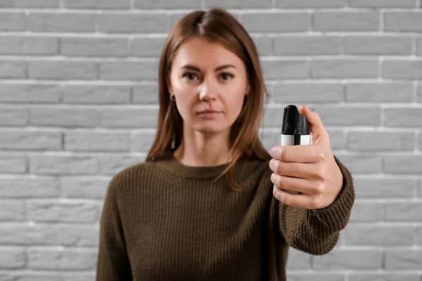 Young Woman Pepper Spray Self Defence Grey Brick Background Closeup — Stock Photo, Image