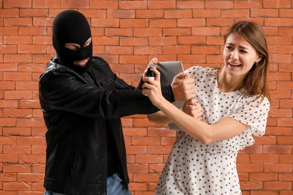 Young Woman Pepper Spray Defending Herself Thief Brick Background — Foto de Stock