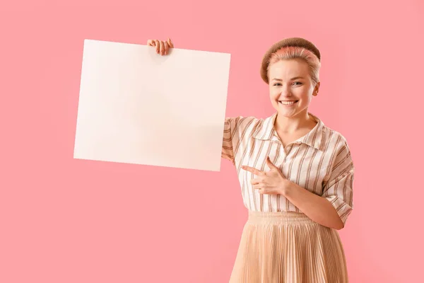 Young Woman Pointing Blank Poster Pink Background — Stock Photo, Image