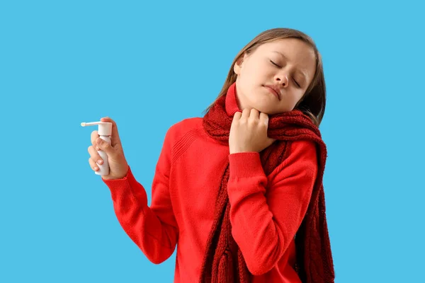 Ill Little Girl Spray Sore Throat Blue Background — Stock Photo, Image