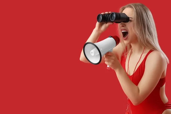 Female Lifeguard Binoculars Shouting Megaphone Red Background — Stock Photo, Image