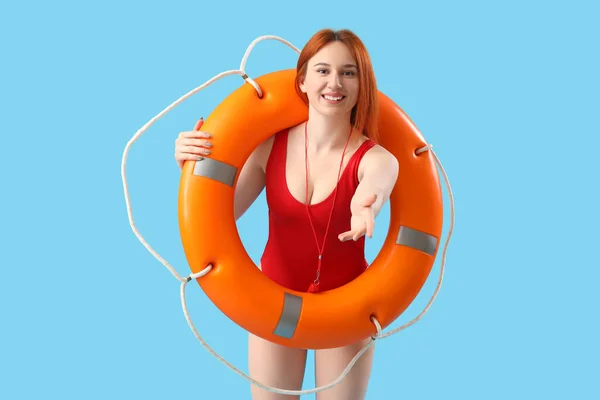 Female Lifeguard Ring Buoy Blue Background — Stock Photo, Image
