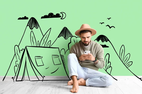 Barefooted Man Mobile Phone Sitting Green Wall Drawn Camping Tent — Stock Photo, Image
