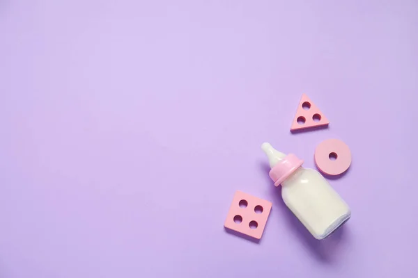 Bottle Milk Baby Toys Lilac Background — Stock Photo, Image